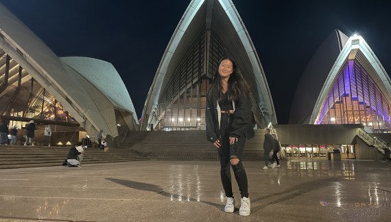 Allison Lee stands in front of Sydney opera house