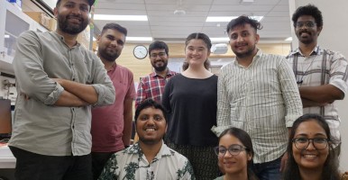 Global Intern Haruna Floate stands with her lab mates at Ashoka University.