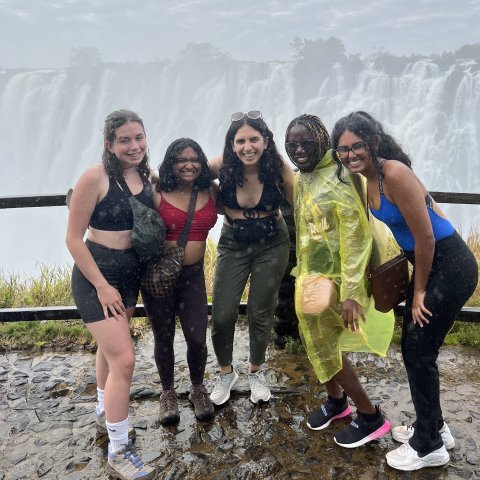 Students in front of waterfall