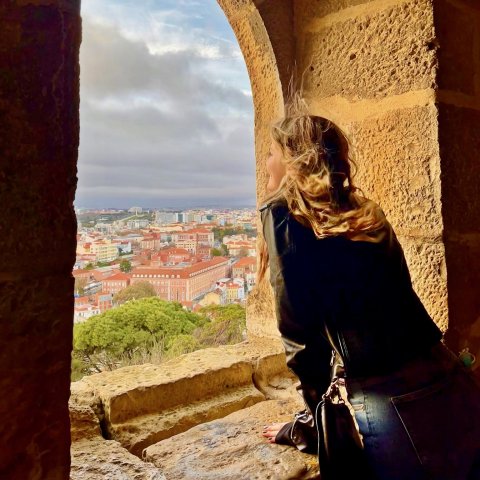 Student looks out window in Spain 